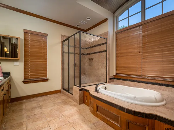 a bathroom with a tub and a sink