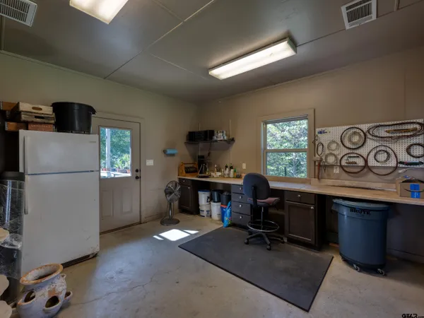 a workspace with furniture and a window