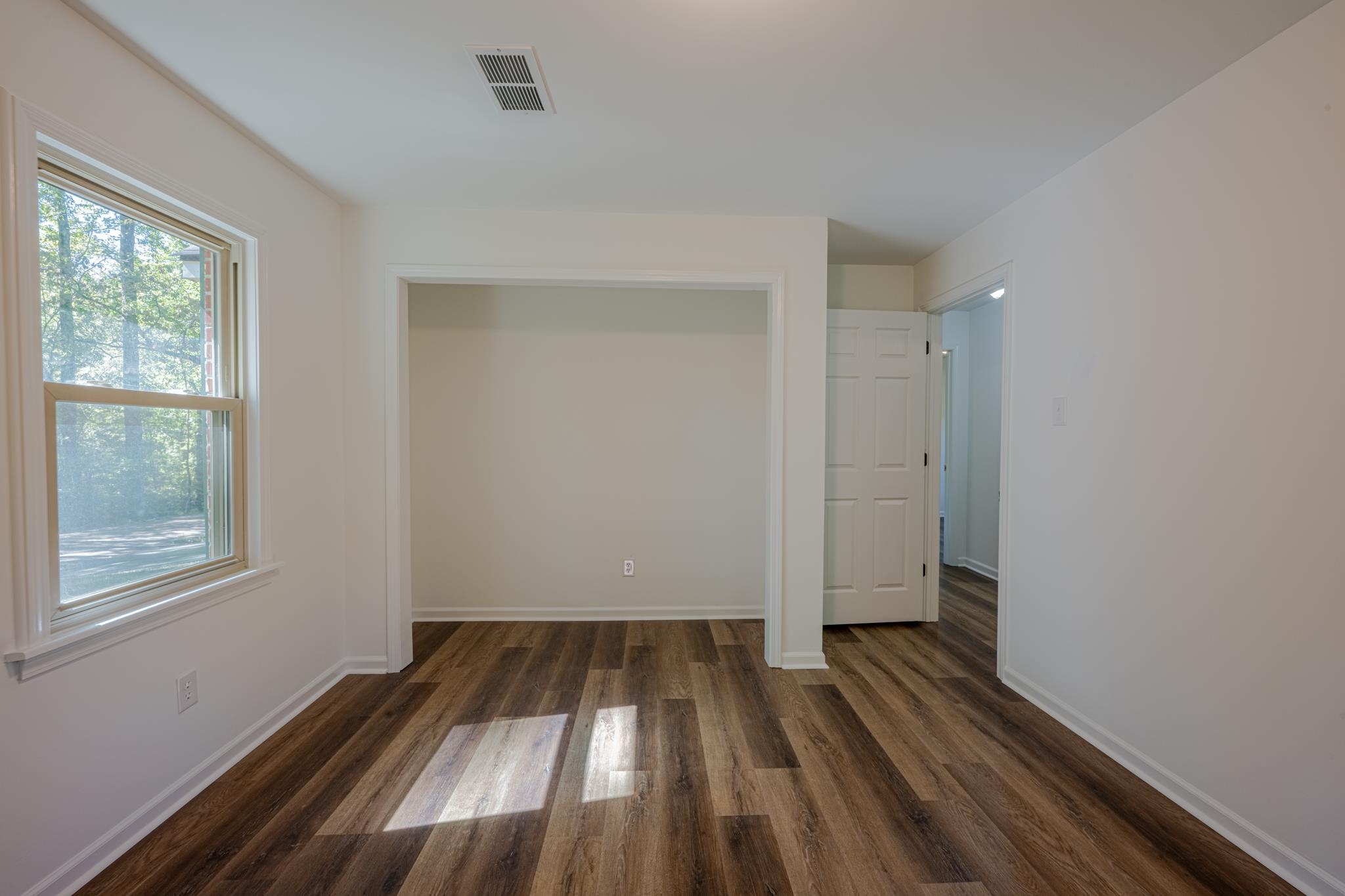 3560 Charles Bartlett Road Millington, TN 38053 - Photo 12 of 28 a view of a room with wooden floor cabinets and a window