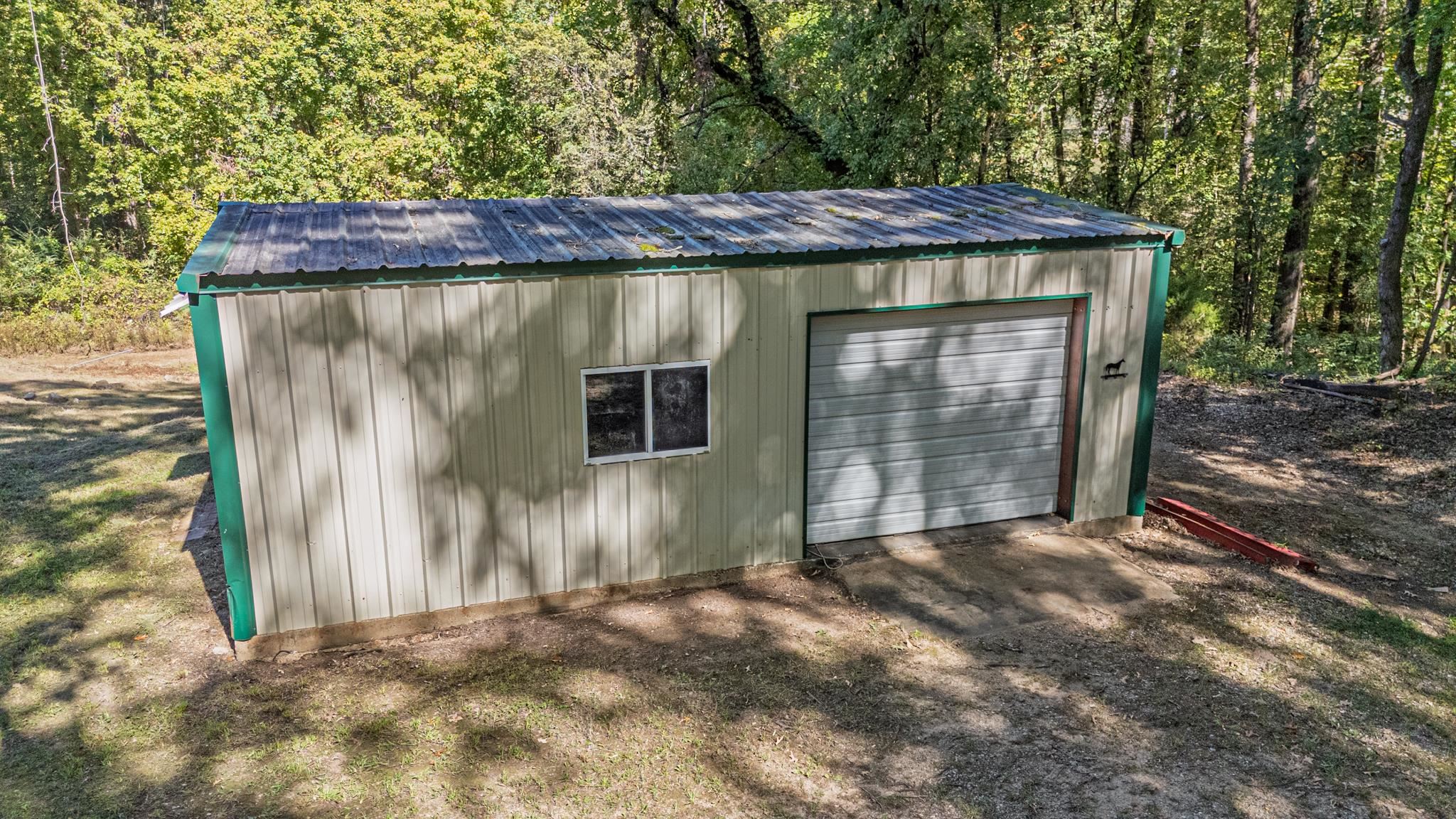 3560 Charles Bartlett Road Millington, TN 38053 - Photo 21 of 28 a view of a small house with wooden fence