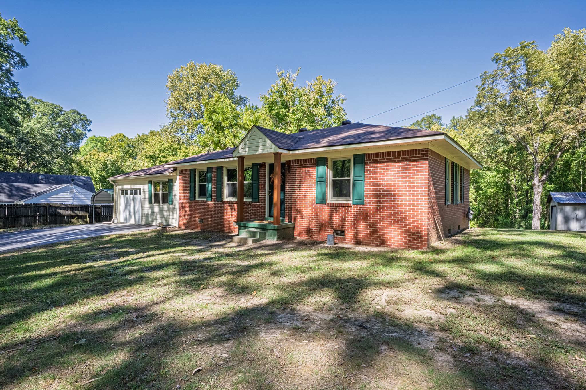 3560 Charles Bartlett Road Millington, TN 38053 - Photo 27 of 28 a view of a house with a yard patio and fire pit