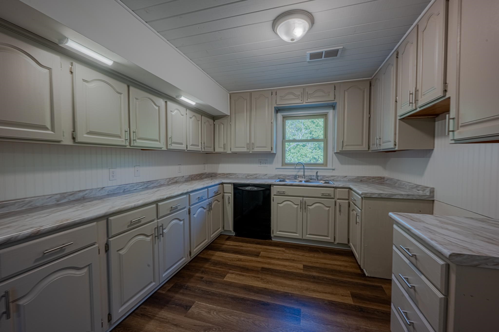 3560 Charles Bartlett Road Millington, TN 38053 - Photo 5 of 28 a kitchen with granite countertop cabinets stainless steel appliances a sink and window