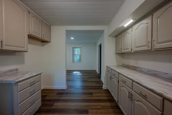 a kitchen with sink and cabinets