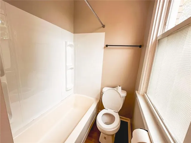 a bathroom with a toilet and a sink