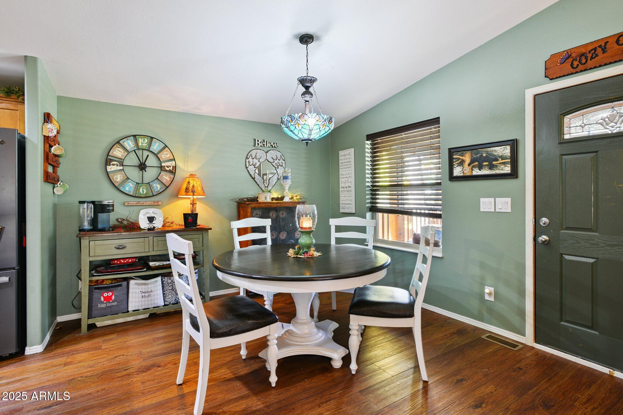 1220 Caribou Road Munds Park, AZ 86017 - Photo 12 of 42 a dining room with furniture and window
