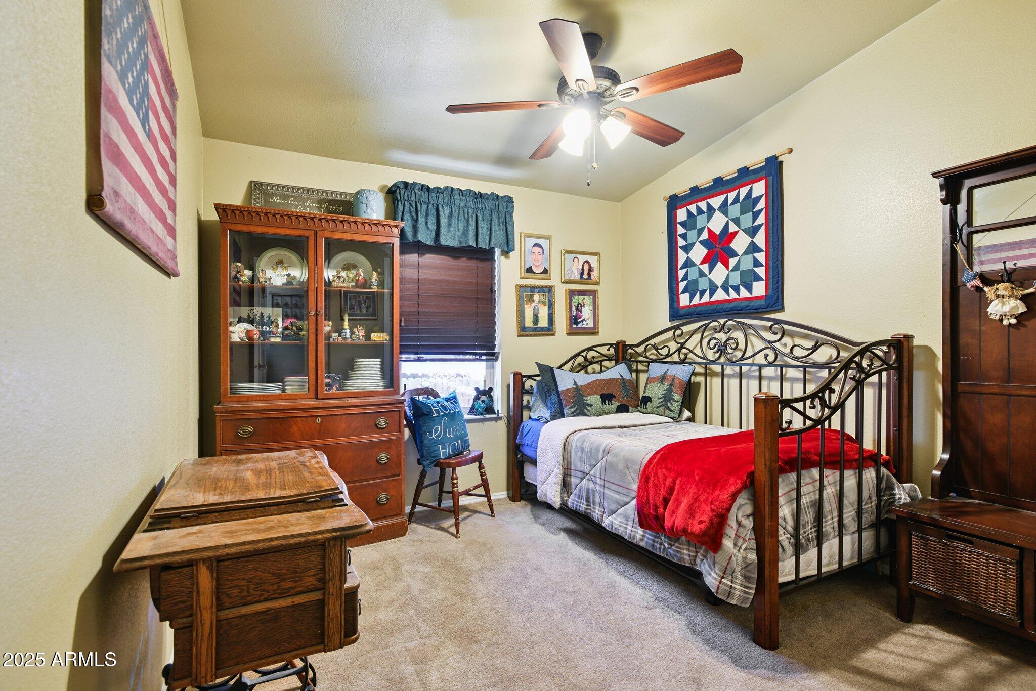 1220 Caribou Road Munds Park, AZ 86017 - Photo 21 of 42 a bedroom with bed and window