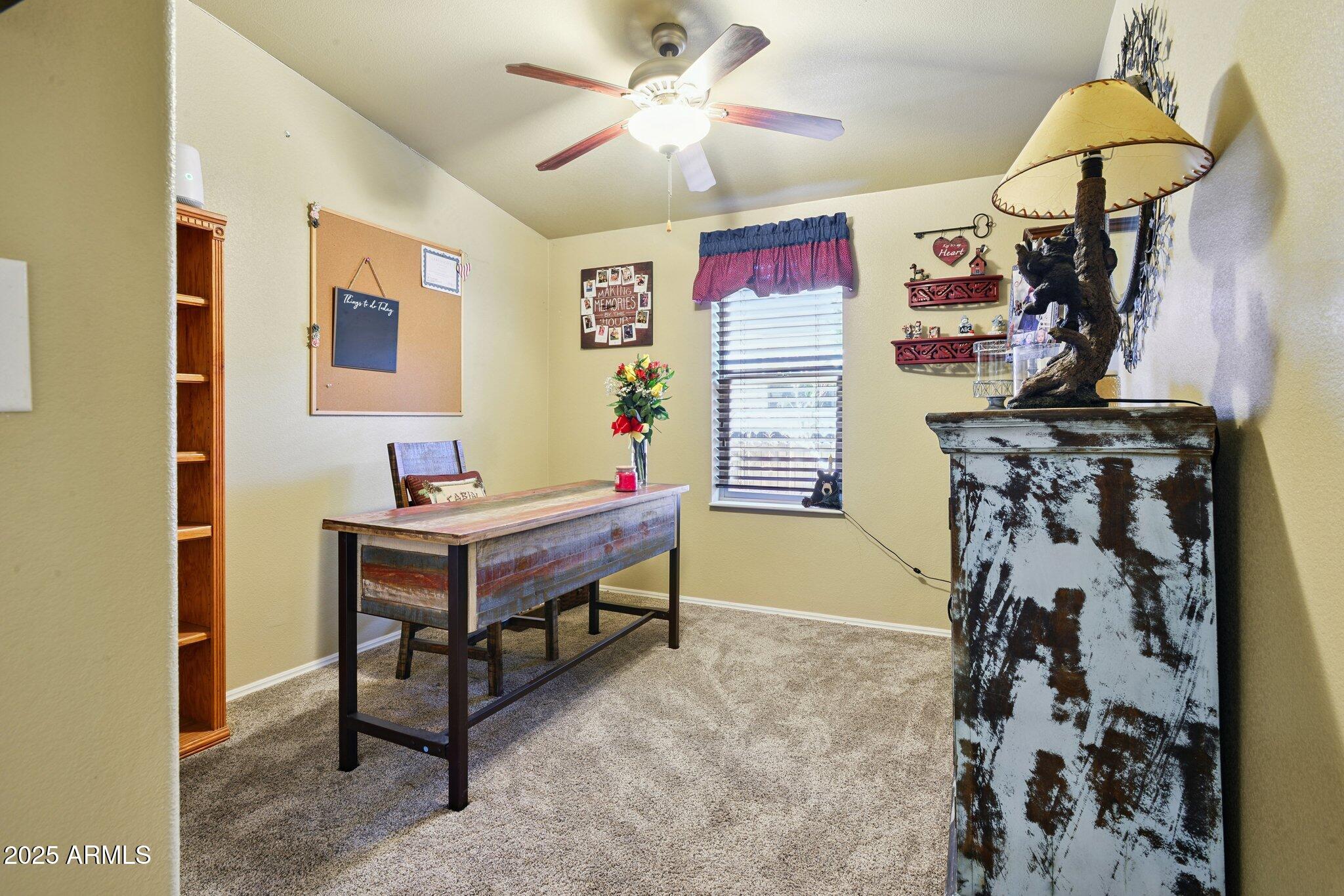 1220 Caribou Road Munds Park, AZ 86017 - Photo 23 of 42 a room with musical instruments and fan