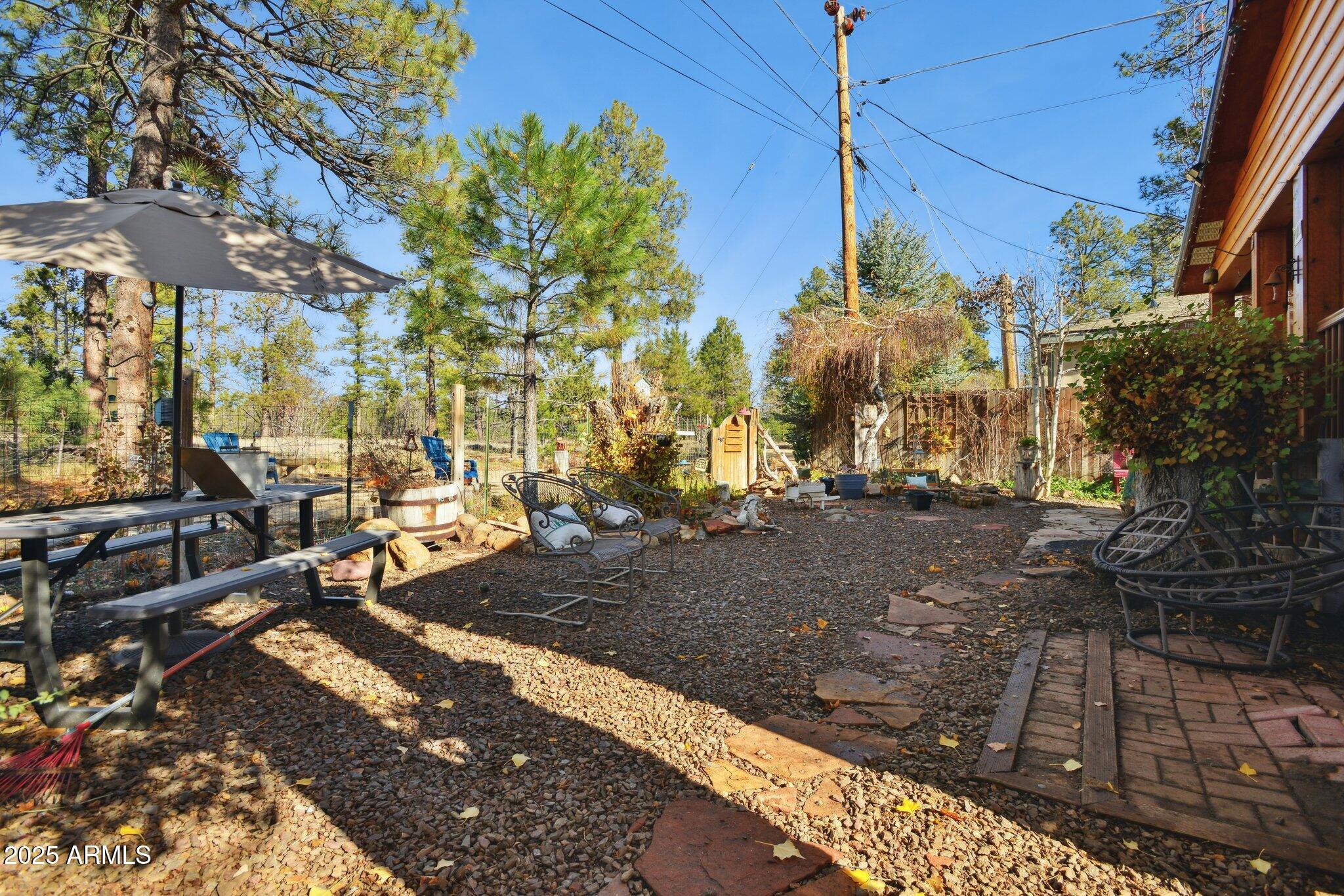 1220 Caribou Road Munds Park, AZ 86017 - Photo 32 of 42 a view of a street with sitting area