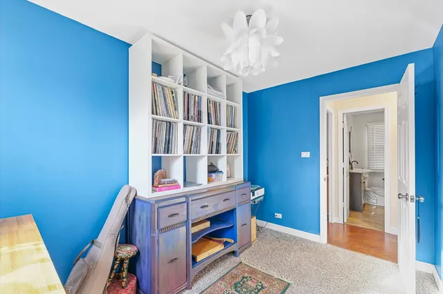 a bedroom with furniture and a chandelier