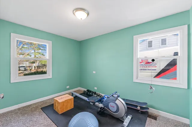 a room with furniture and painting on the wall