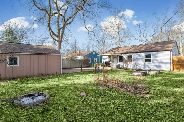 a backyard of a house with lots of green space