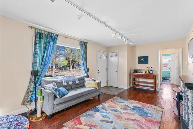 a living room with furniture and a rug