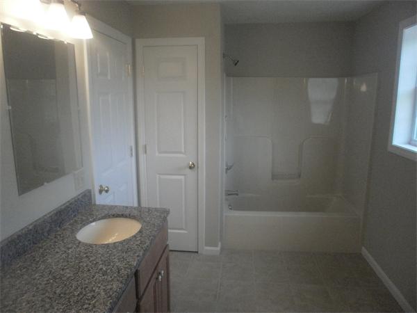 7 Beaver Path Wareham, MA 02576 - Photo 20 of 21 a bathroom with a granite countertop sink and mirror