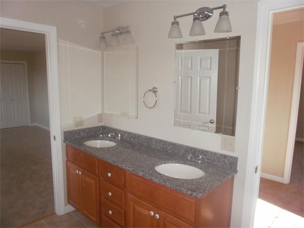 7 Beaver Path Wareham, MA 02576 - Photo 21 of 21 a bathroom with a granite countertop sink and a mirror