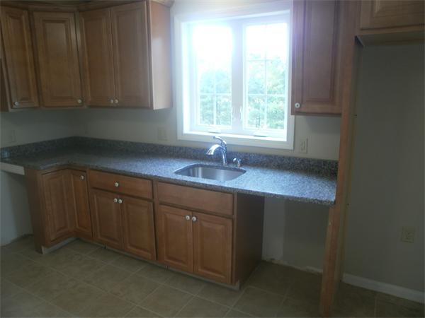 7 Beaver Path Wareham, MA 02576 - Photo 6 of 21 a kitchen with sink window and cabinets