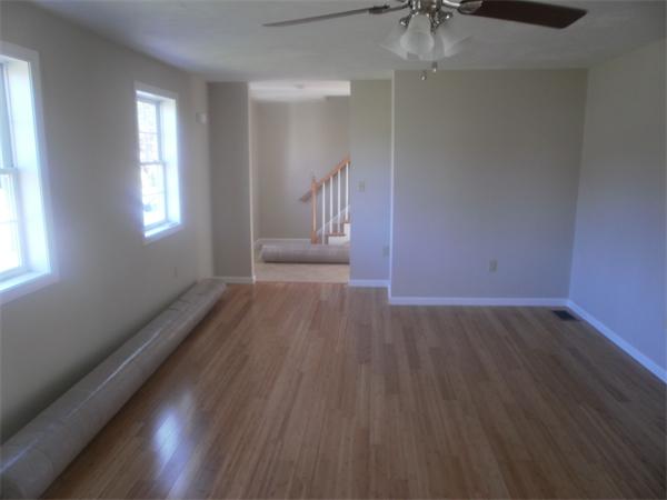 7 Beaver Path Wareham, MA 02576 - Photo 9 of 21 an empty room with wooden floor and windows