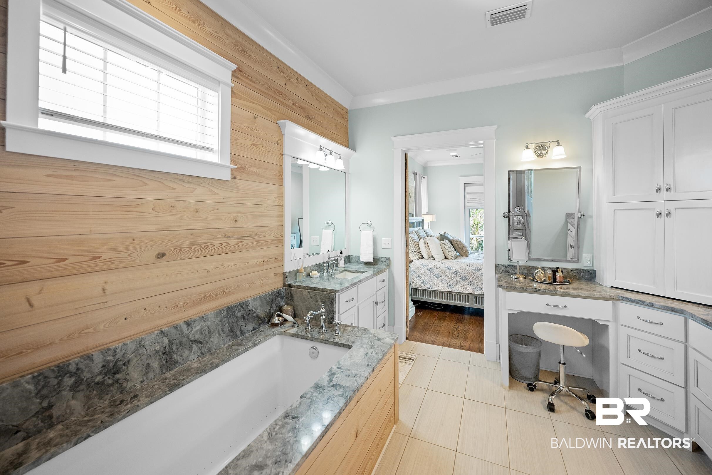 33186 Marlin Key Drive Orange Beach, AL 36561 - Photo 54 of 87 Full bath featuring vanity, a garden tub, ensuite bath, light tile patterned floors, and crown molding