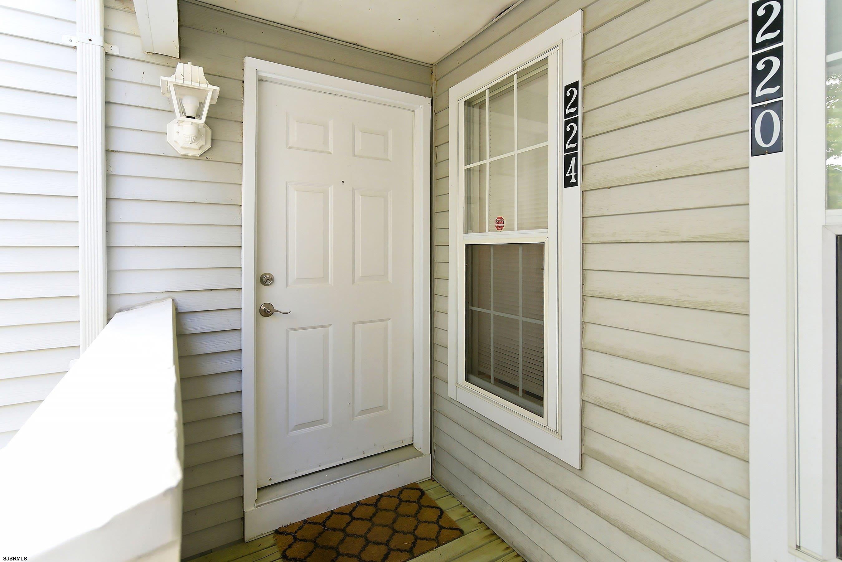 224 Meadow Ridge Road, Unit 224 Smithville, NJ 08205 - Photo 3 of 22 a view of front door of house