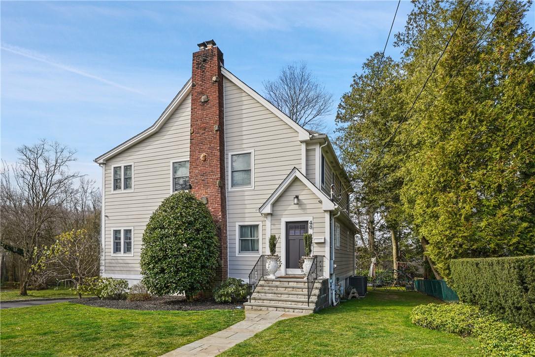 48 Carthage Road Scarsdale, NY 10583 - Photo 1 of 1 a front view of a house with a yard