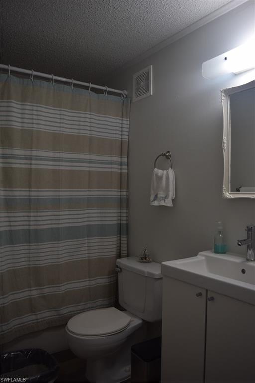 5318 Treetops Drive, Unit IG3 Naples, FL 34113 - Photo 7 of 13 a bathroom with a toilet and a sink