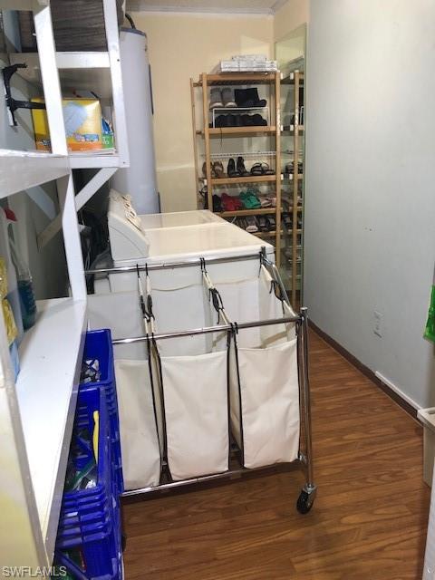 5318 Treetops Drive, Unit IG3 Naples, FL 34113 - Photo 9 of 13 a very nice looking room with wooden floor