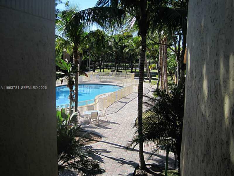 7913 Southwest 104th Street, Unit G207 Miami, FL 33156 - Photo 3 of 11 a view of swimming pool