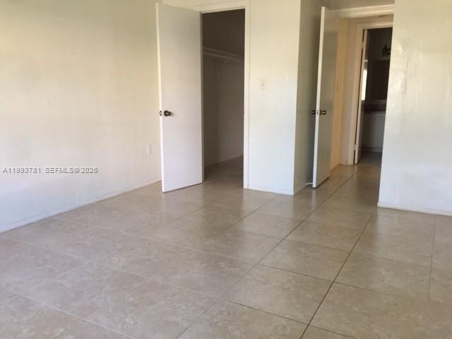 7913 Southwest 104th Street, Unit G207 Miami, FL 33156 - Photo 6 of 11 a view of an empty room