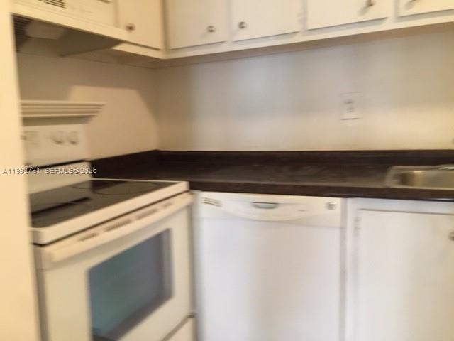 7913 Southwest 104th Street, Unit G207 Miami, FL 33156 - Photo 9 of 11 a close view of washer and dryer