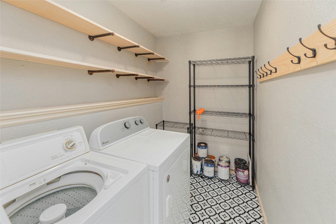 801 East 3rd Street Georgetown, TX 78626 - Photo 22 of 26 Laundry room featuring washer and dryer.
