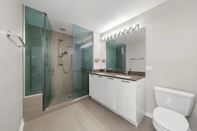 a bedroom with a large bed and a large window