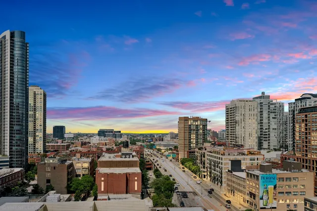 a view of a city with tall buildings