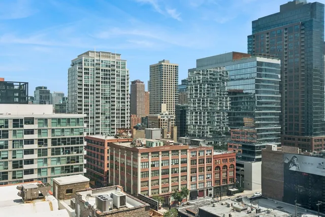 a view of a city with tall buildings