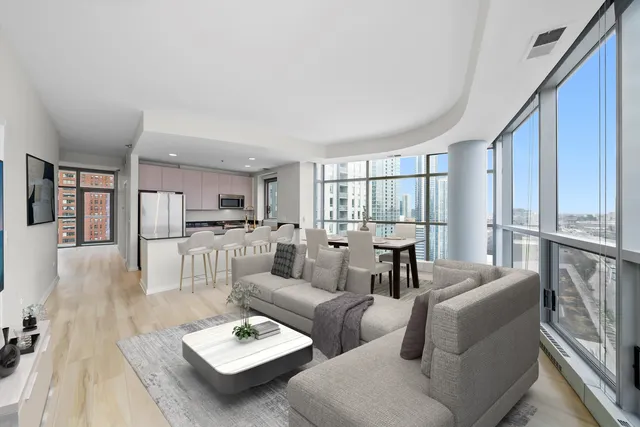 a kitchen with stainless steel appliances a refrigerator and a stove top oven