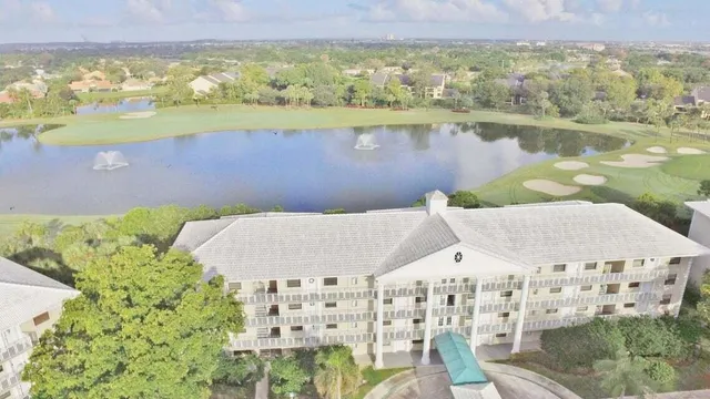 a view of a lake with a building in the background