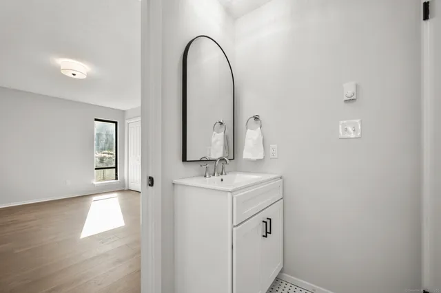 a bathroom with a sink and a mirror