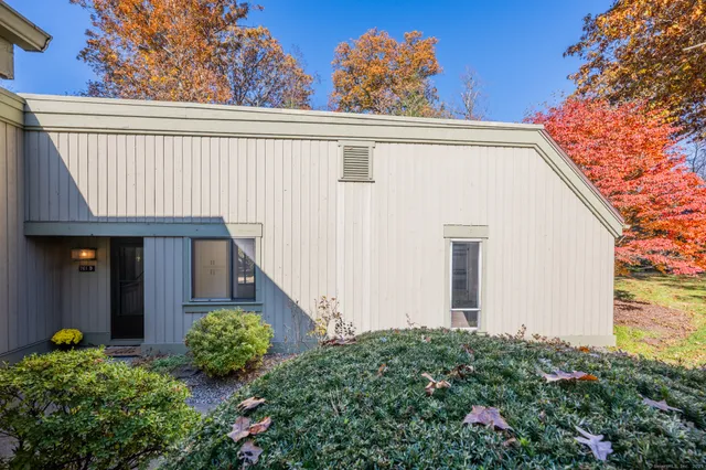 a view of a house with a flower garden