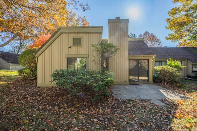 a view of a house with a yard and plants