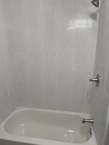 a close view of a bathtub in bathroom