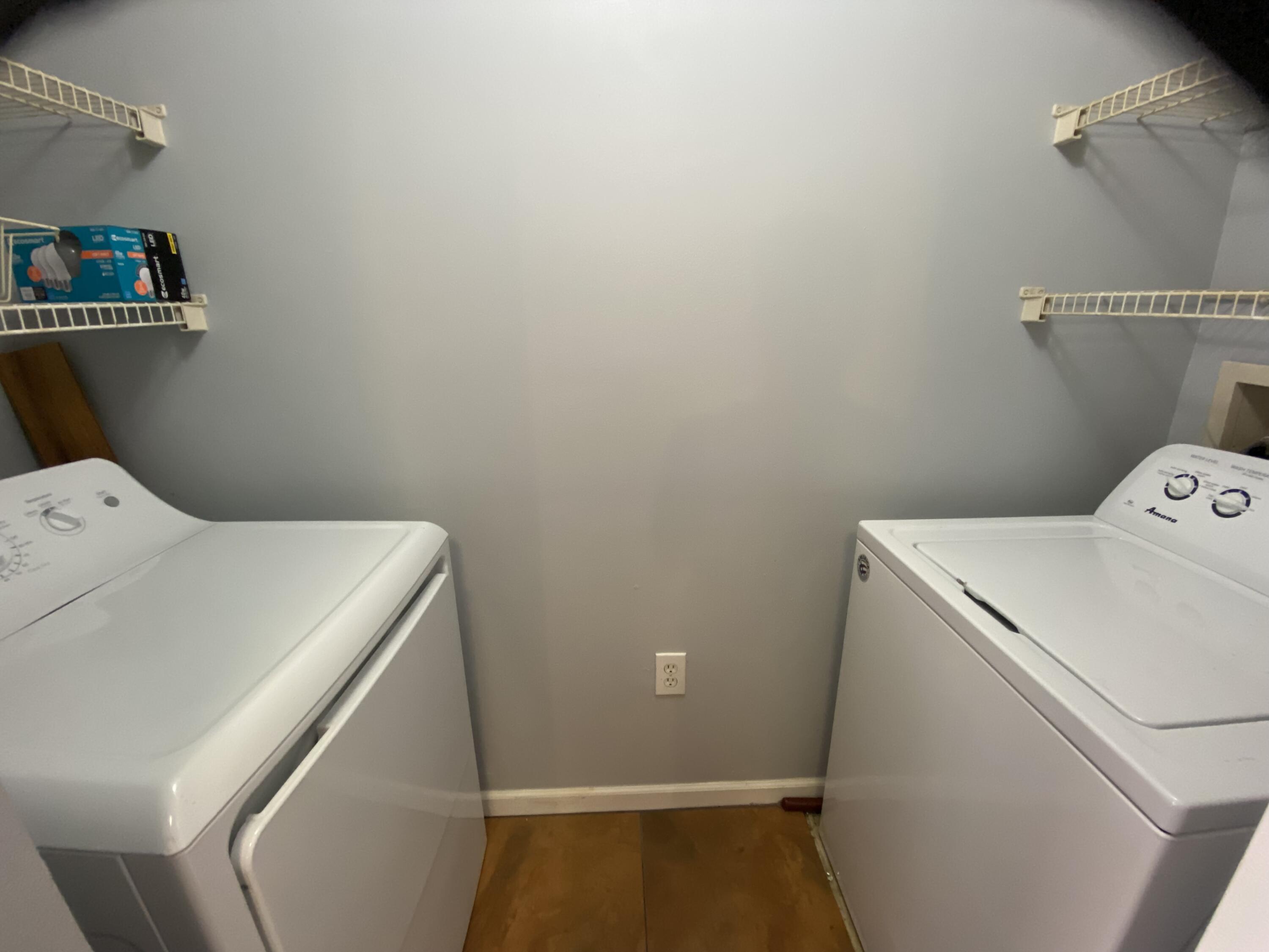 3602 Northwest Adriatic Lane, Unit 6105 Jensen Beach, FL 34957 - Photo 14 of 18 a utility room with dryer and washer