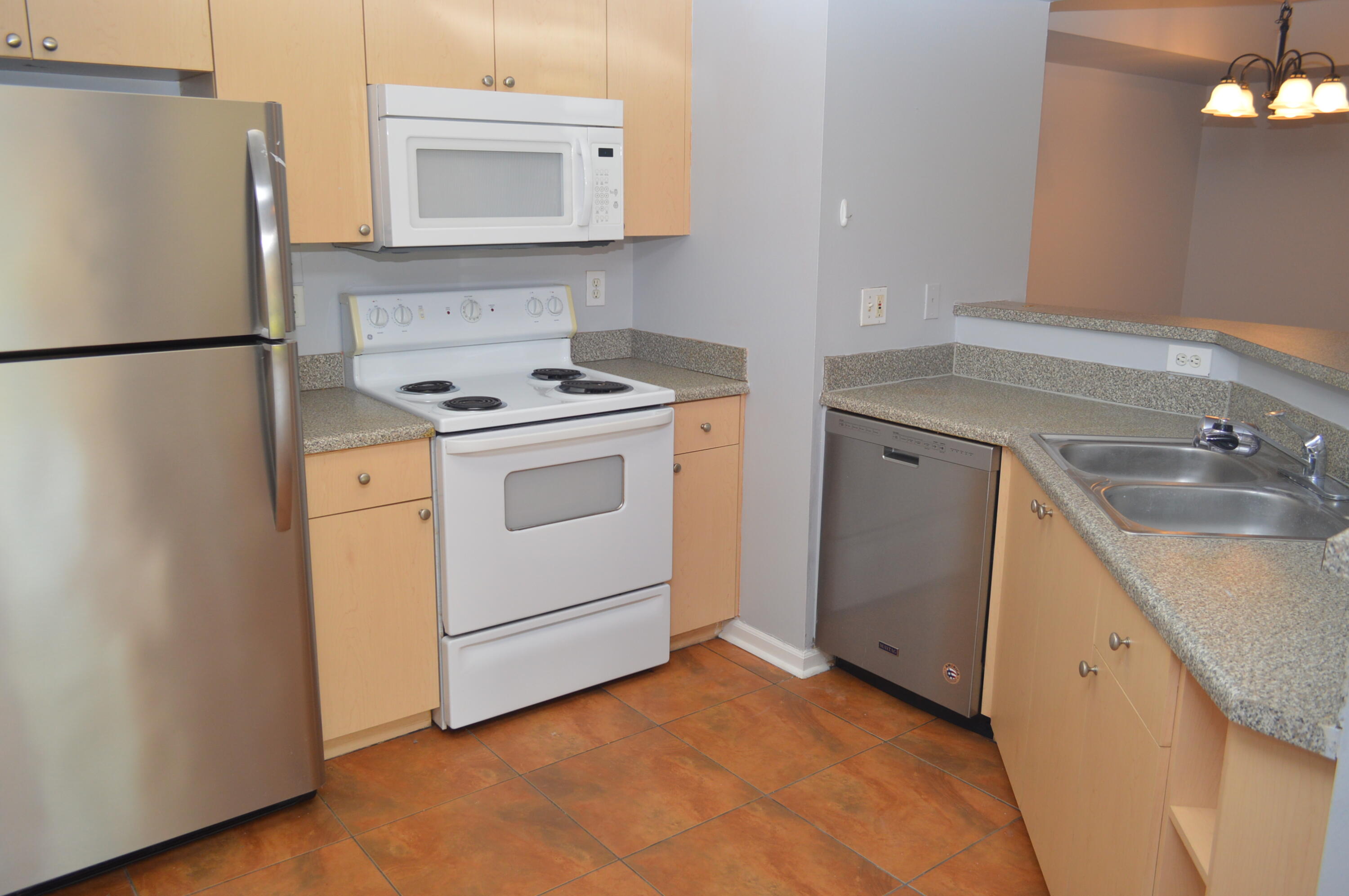 3602 Northwest Adriatic Lane, Unit 6105 Jensen Beach, FL 34957 - Photo 7 of 18 a utility room with sink dryer and washer