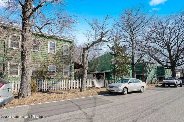 a view of street with parked cars