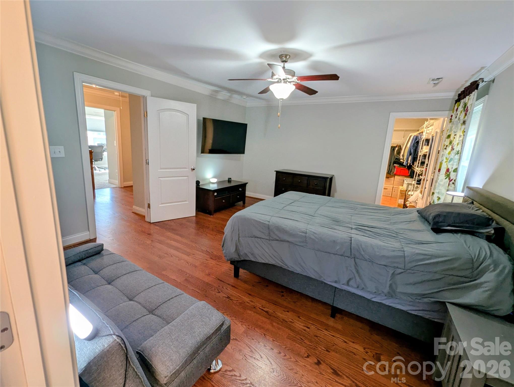 19934 Walter Henderson Road Cornelius, NC 28031 - Photo 27 of 35 a bedroom with a bed and a flat screen tv