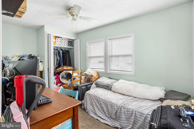a bedroom with bed and a window