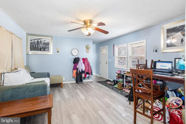 a view of a livingroom with furniture and a flat screen tv
