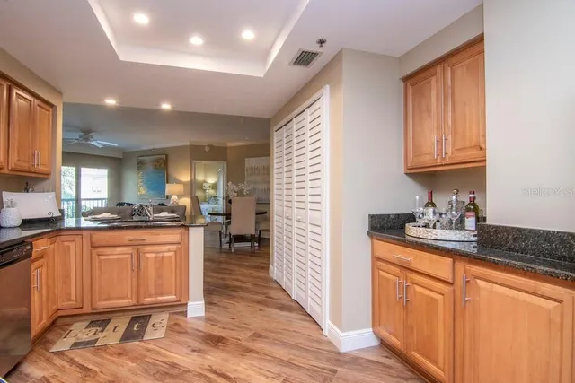a kitchen with a sink and cabinets