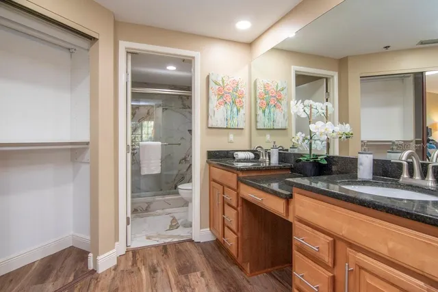 a large kitchen with granite countertop a large counter top and sink
