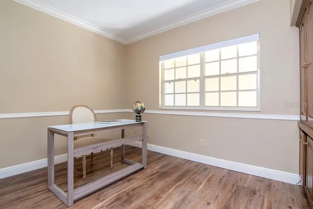 a view of a garden with a house