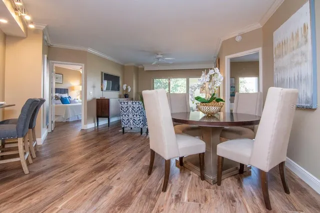 a view of a dining room with furniture window and wooden floor