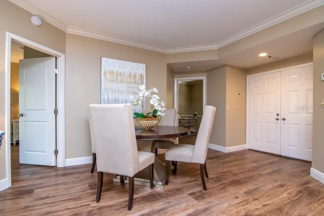 a view of a dining room with furniture window and wooden floor