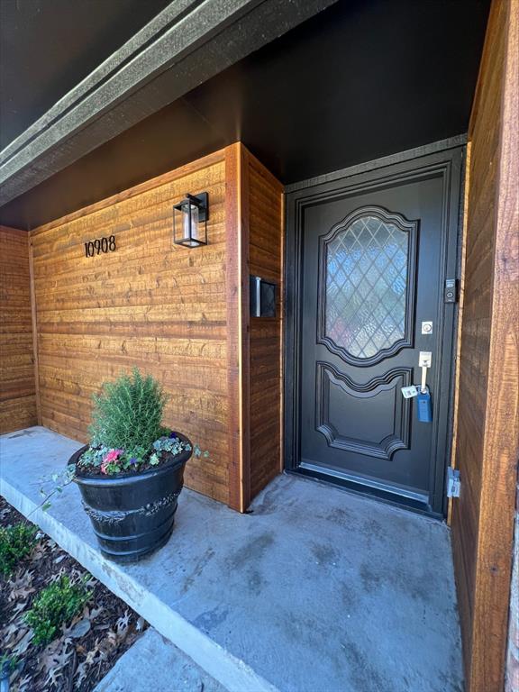 10908 Colbert Way Dallas, TX 75218 - Photo 1 of 1 a room with a stove and a potted plant